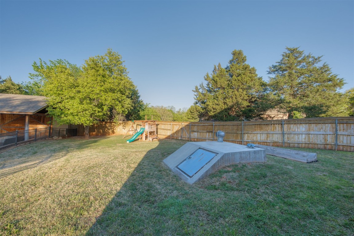 10901 Hunters Pointe, Edmond, OK 73034 view of yard featuring a playground