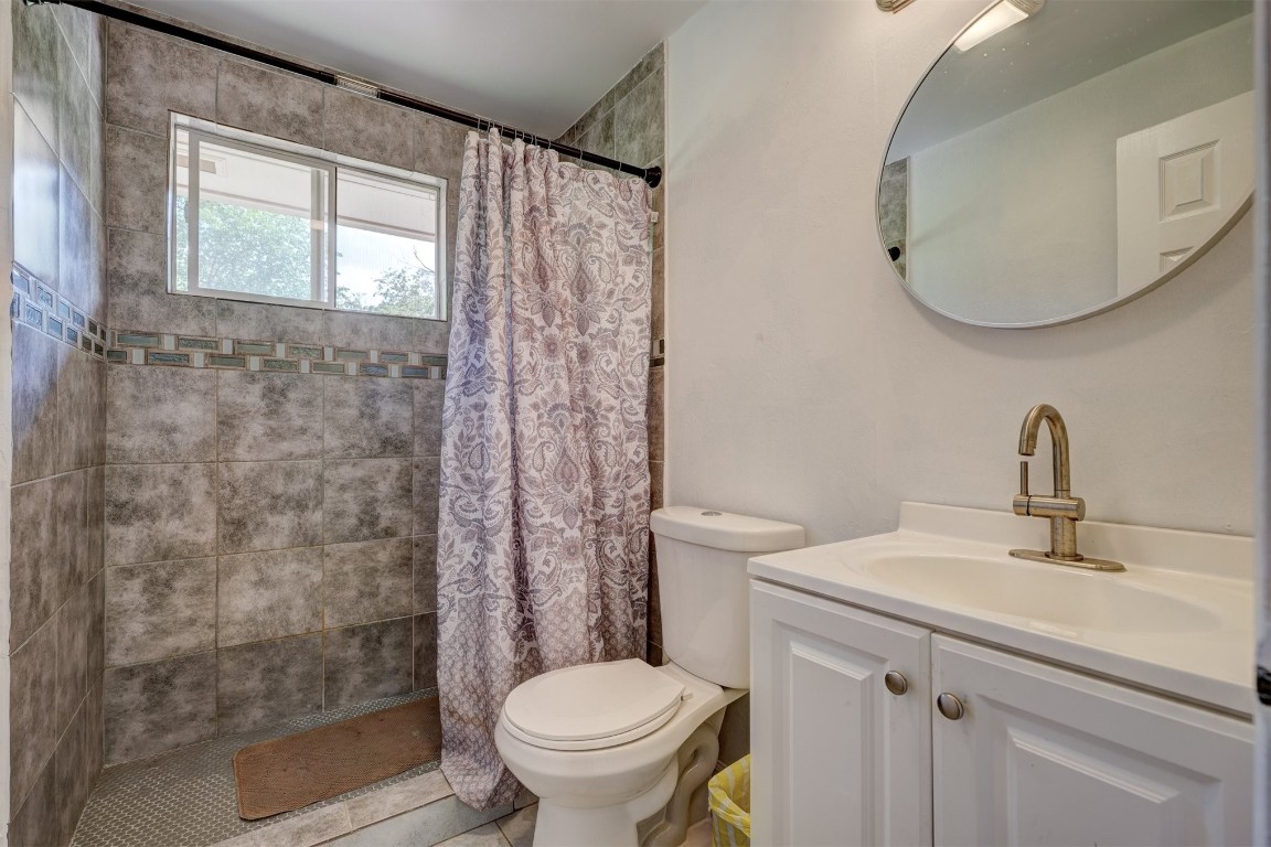 3028 Parker Drive, Oklahoma City, OK 73135 bathroom featuring toilet and vanity