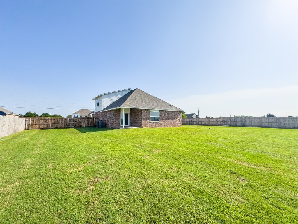 5591 Grassland Drive, Guthrie, OK 73044 exterior space featuring a front yard