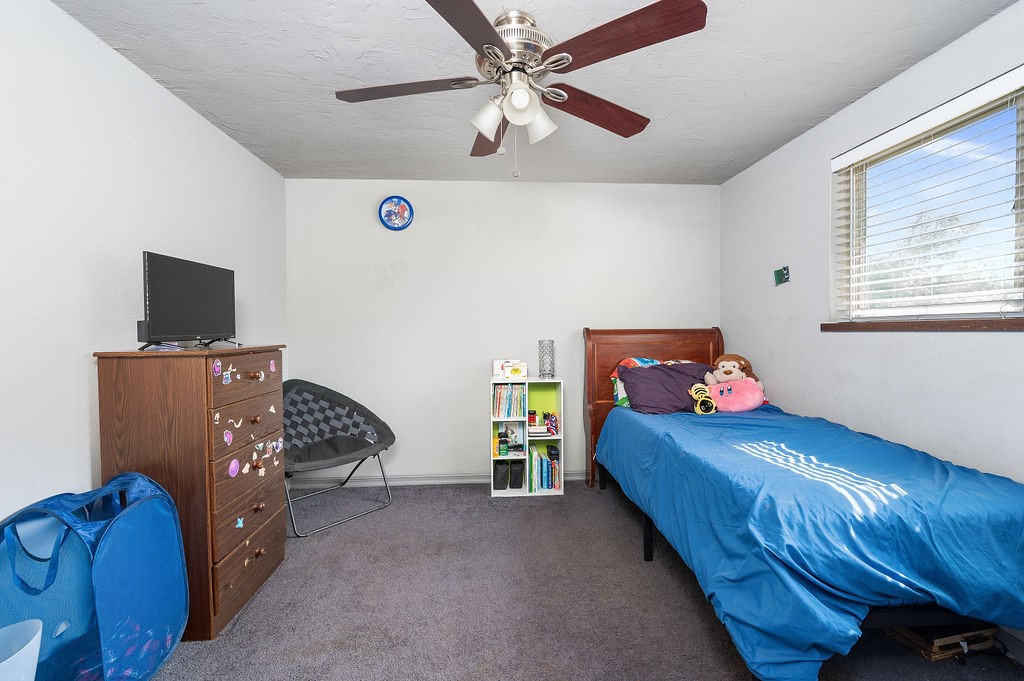 205 Vickie Drive, Del City, OK 73115 carpeted bedroom featuring ceiling fan