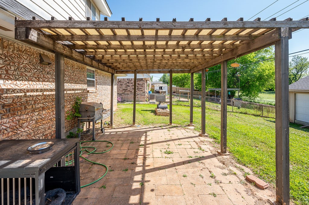205 Vickie Drive, Del City, OK 73115 view of terrace with area for grilling and a pergola