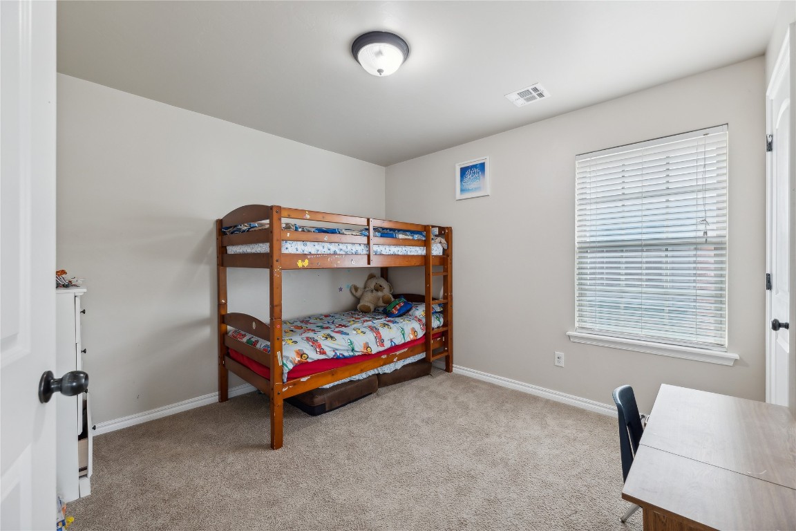 1504 NW 127th Street, Oklahoma City, OK 73120 bedroom with carpet flooring