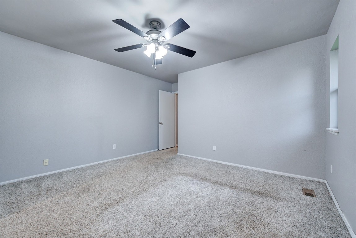 7728 Northgate Avenue, Oklahoma City, OK 73162 spare room with carpet and ceiling fan
