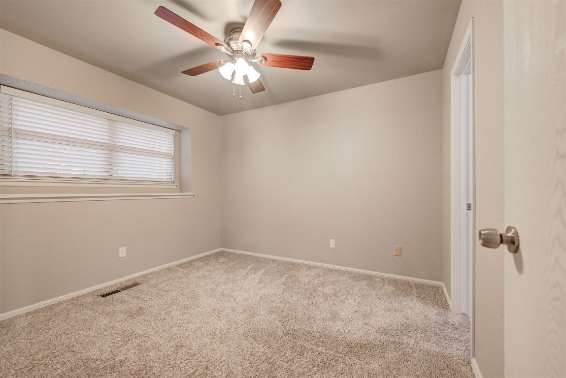 7728 Northgate Avenue, Oklahoma City, OK 73162 carpeted spare room with ceiling fan