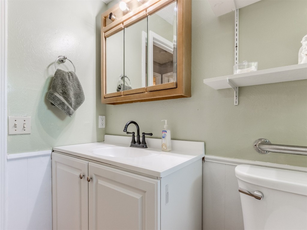 5216 S Briarwood Drive, Oklahoma City, OK 73135-1412 bathroom featuring oversized vanity and toilet