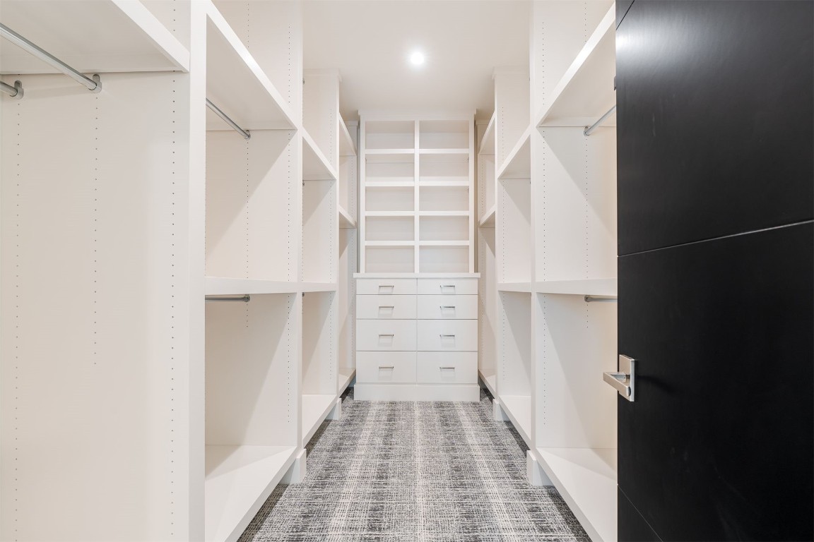 15613 Woodleaf Lane, Edmond, OK 73013 spacious closet with carpet flooring