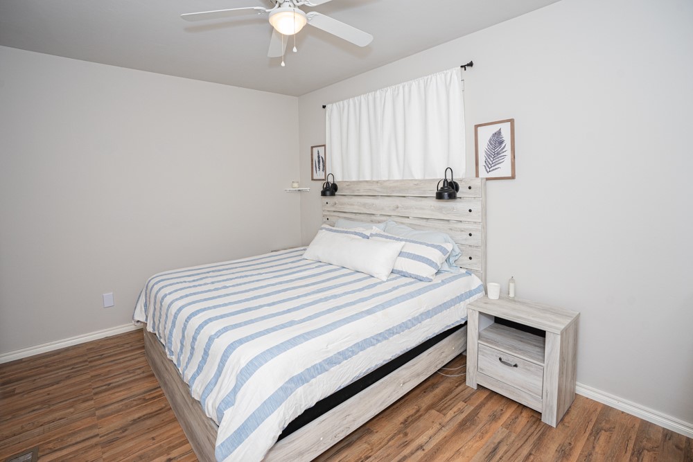 2508 Thornberry Lane, Yukon, OK 73099 bedroom featuring dark hardwood / wood-style floors and ceiling fan