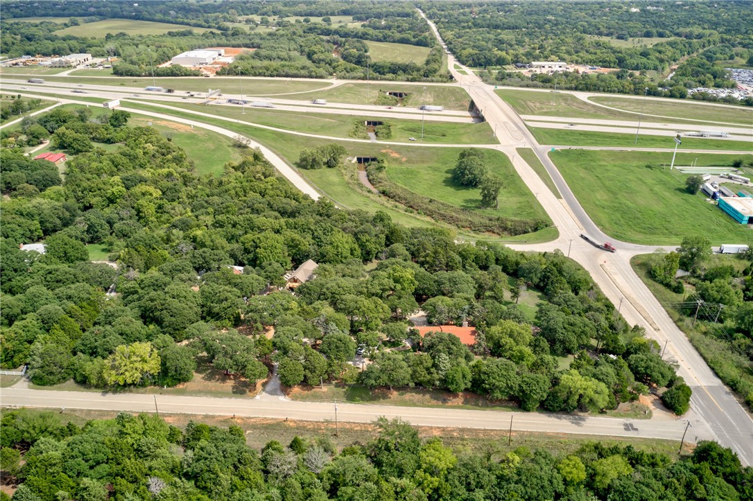 The property consists of 5.9 acres MOL on the hard corner of Interstate 35 service road and East Wilshire Boulevard (NE 78th Street). It borders 1-35 west access road on its east border with approximately 550 ft. of frontage on the access road. Current zoning is 1-1 PUD-1083. The property has two (2) residential structures that were originally constructed in 1947. They are both functional and are in current use for residential purposes. The most northerly structure has a three (3) room office area in its 2nd level.