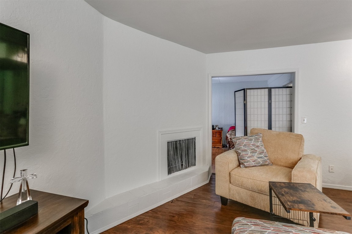 6732 N Meridian Avenue, #E, Oklahoma City, OK 73116 living room featuring dark hardwood / wood-style floors