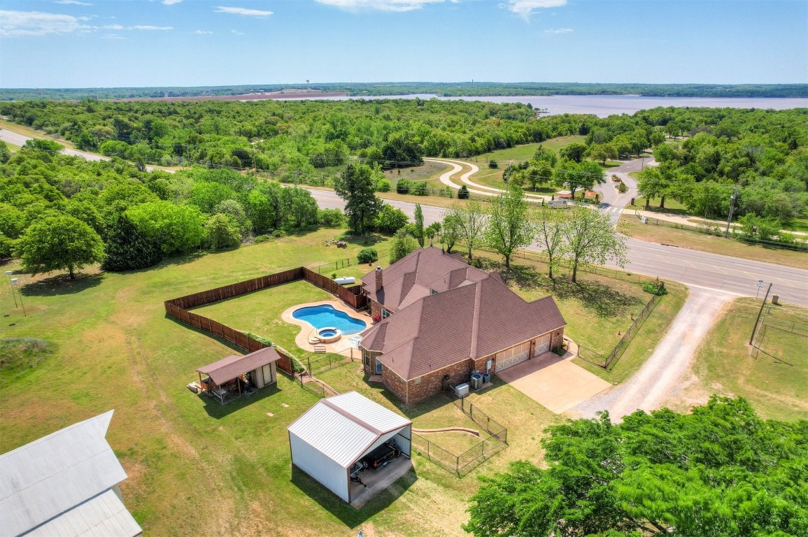 7829 E 2nd Street, Edmond, OK 73034 drone / aerial view with a water view