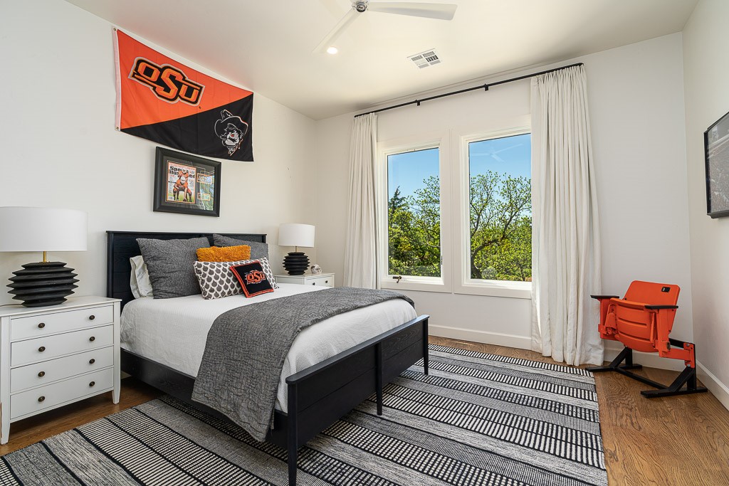 2525 Spring Lake Court, Jones, OK 73049 bedroom featuring ceiling fan and dark hardwood / wood-style floors