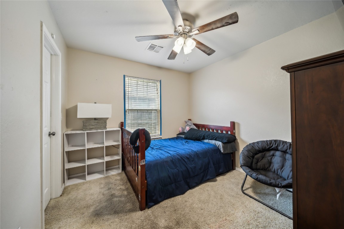 3193 S 206th  East Place, Broken Arrow, OK 74014 bedroom with light carpet and ceiling fan