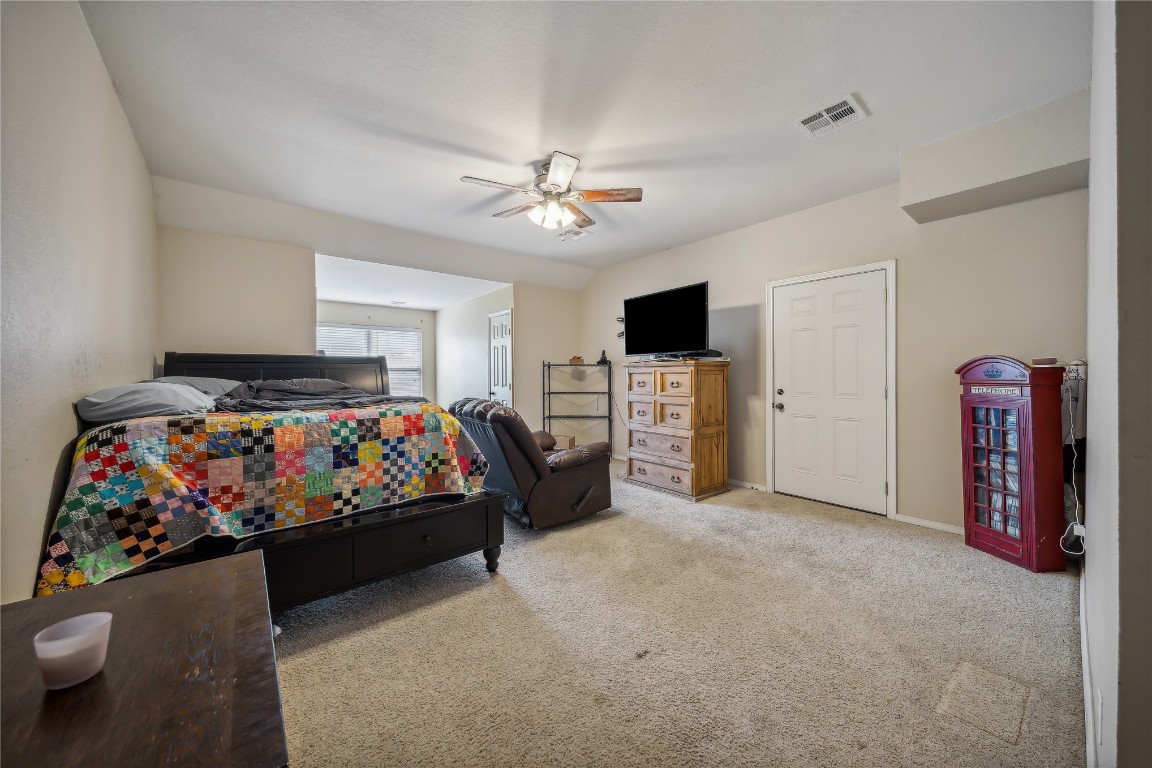 3193 S 206th  East Place, Broken Arrow, OK 74014 bedroom with ceiling fan and carpet