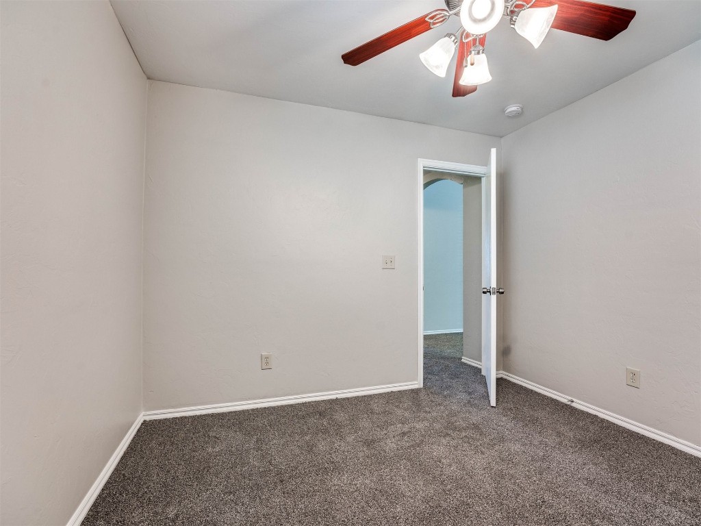 8613 SW 46th Place, Oklahoma City, OK 73179 carpeted spare room with ceiling fan