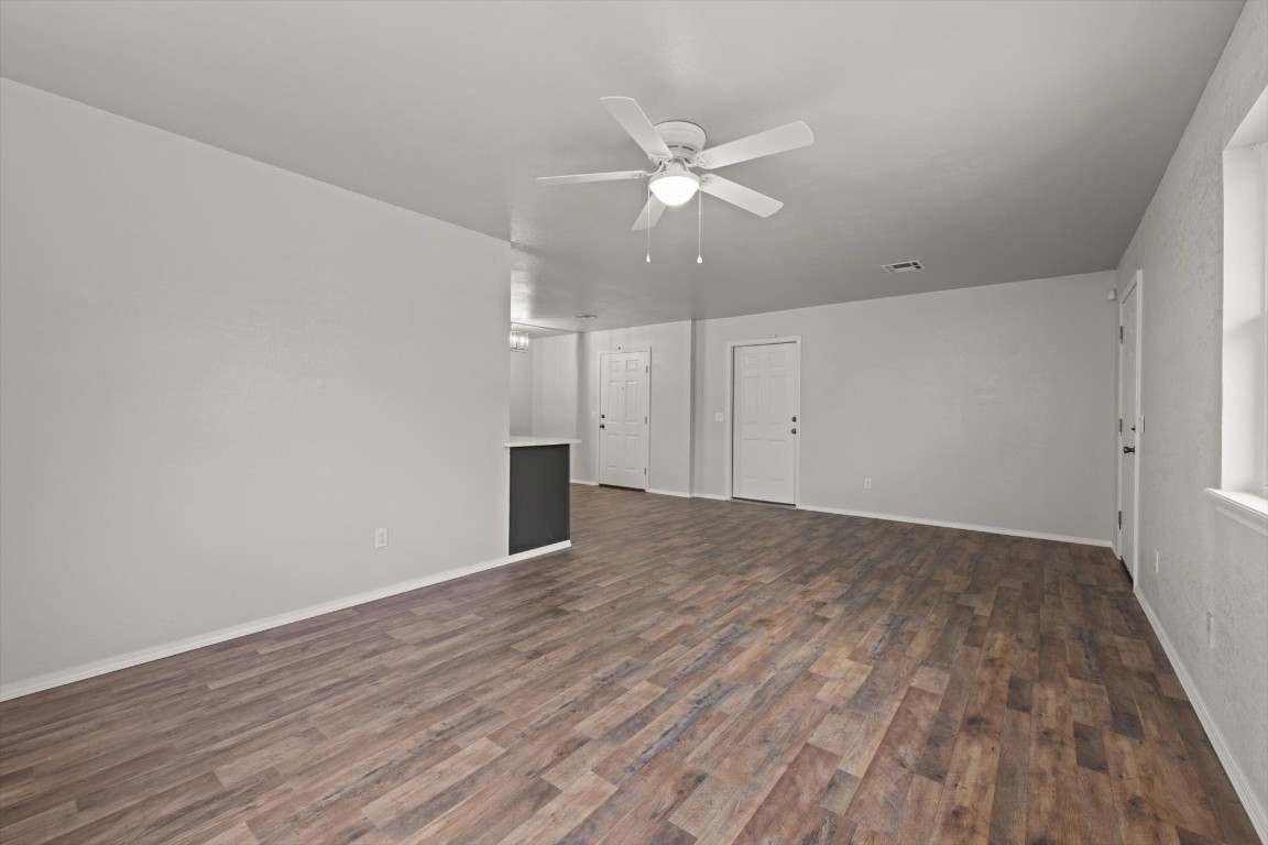 1619 W Oklahoma Avenue, Guthrie, OK 73044 spare room with dark wood-type flooring and ceiling fan