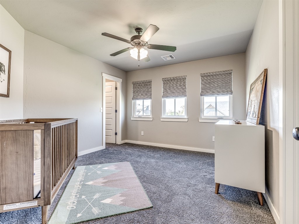 280 Old Farm Road, Edmond, OK 73034 interior space featuring ceiling fan and dark carpet