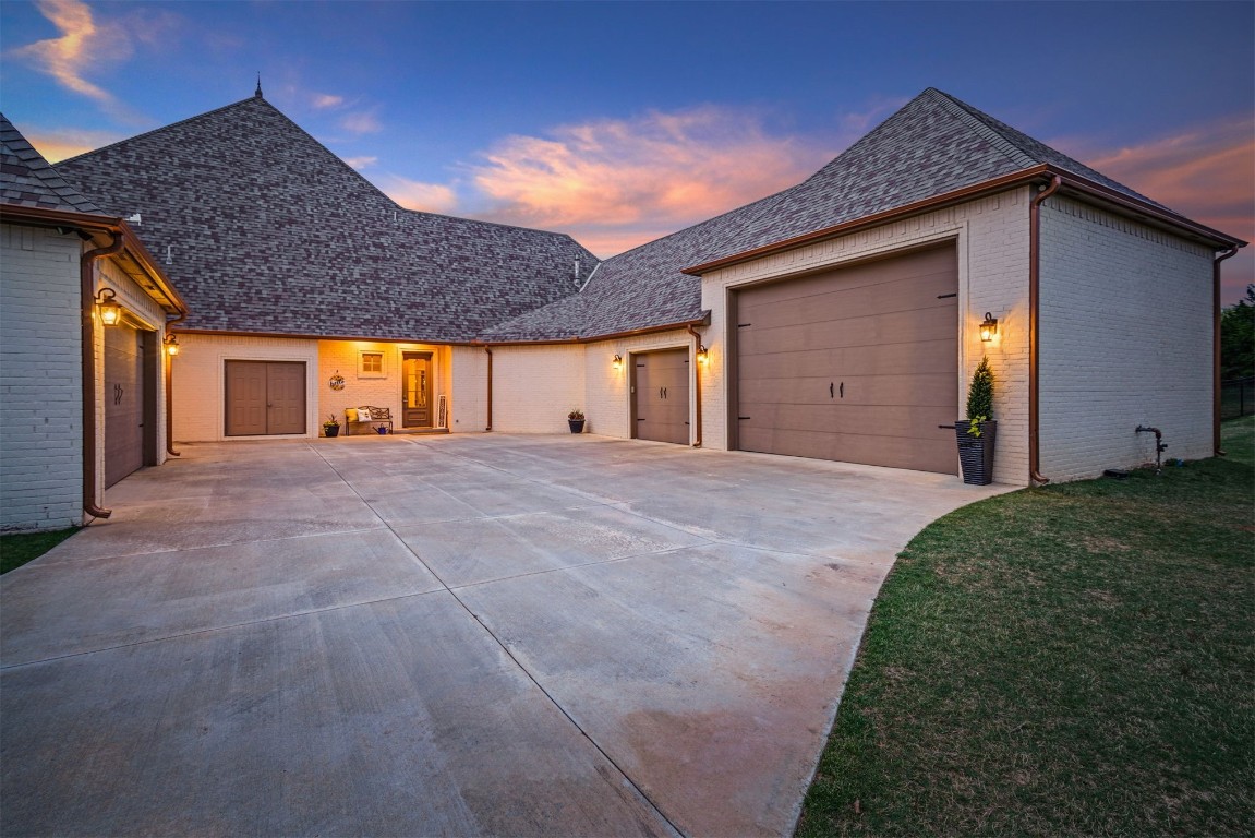 3600 Sea Ray Channel, Edmond, OK 73013 view of front of property featuring a yard and a garage