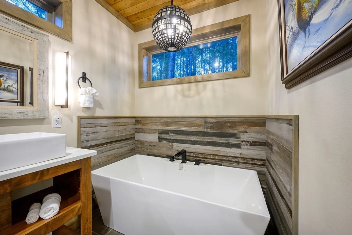 28 Silent Stream Trail, Broken Bow, OK 74728 bathroom with a bathtub, vanity, and wooden ceiling