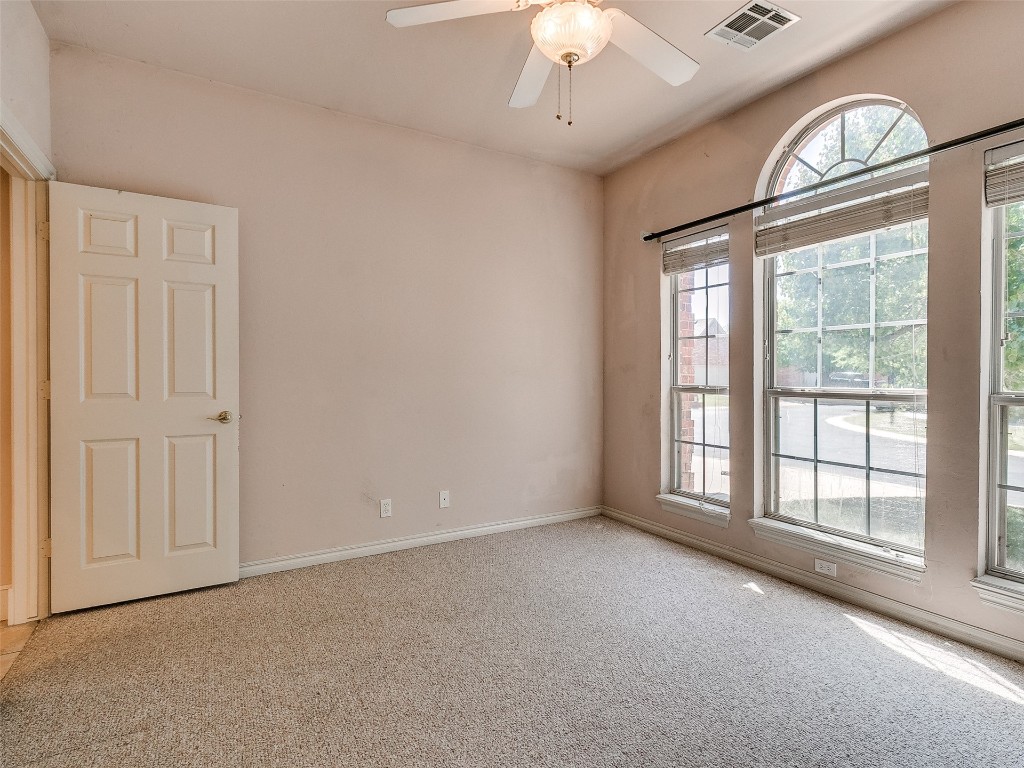6508 NW 109th Place, Oklahoma City, OK 73162 carpeted spare room featuring ceiling fan