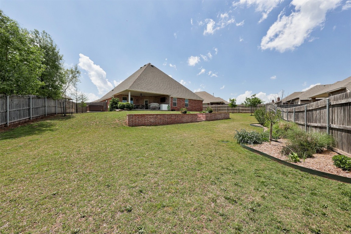 6233 Beverly Hills Drive, Edmond, OK 73034 view of yard with a patio