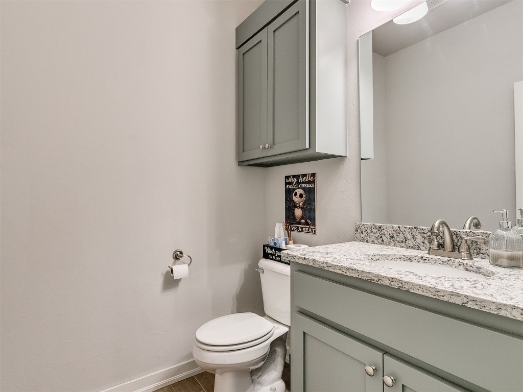 3111 Wood Valley Road, Norman, OK 73071 bathroom featuring tile flooring, toilet, and large vanity