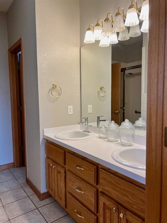 180 N Lakeside Terrace, Mustang, OK 73064 bathroom featuring tile floors and dual vanity