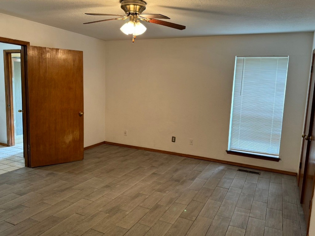 1810 Remington Circle, Shawnee, OK 74801 empty room with light hardwood / wood-style floors and ceiling fan