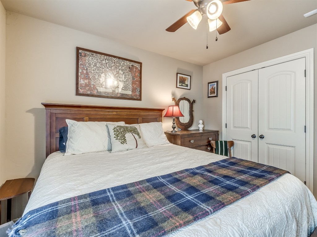2924 Woodcrest Creek Drive, Norman, OK 73071 bedroom featuring a closet and ceiling fan