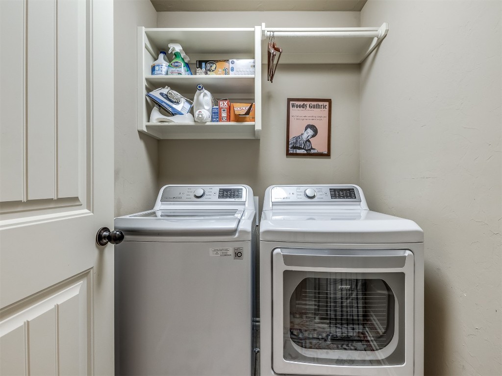 2924 Woodcrest Creek Drive, Norman, OK 73071 laundry room with washer and clothes dryer