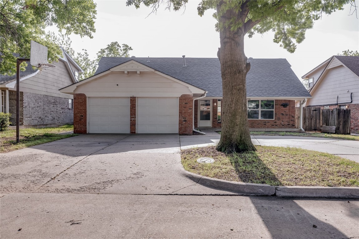 3620 Ridgehaven Drive, Midwest City, OK 73110 ranch-style house with a garage