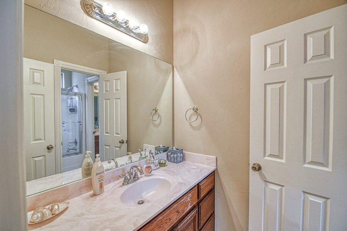 4508 Greystone Lane, Norman, OK 73072 bathroom featuring vanity with extensive cabinet space