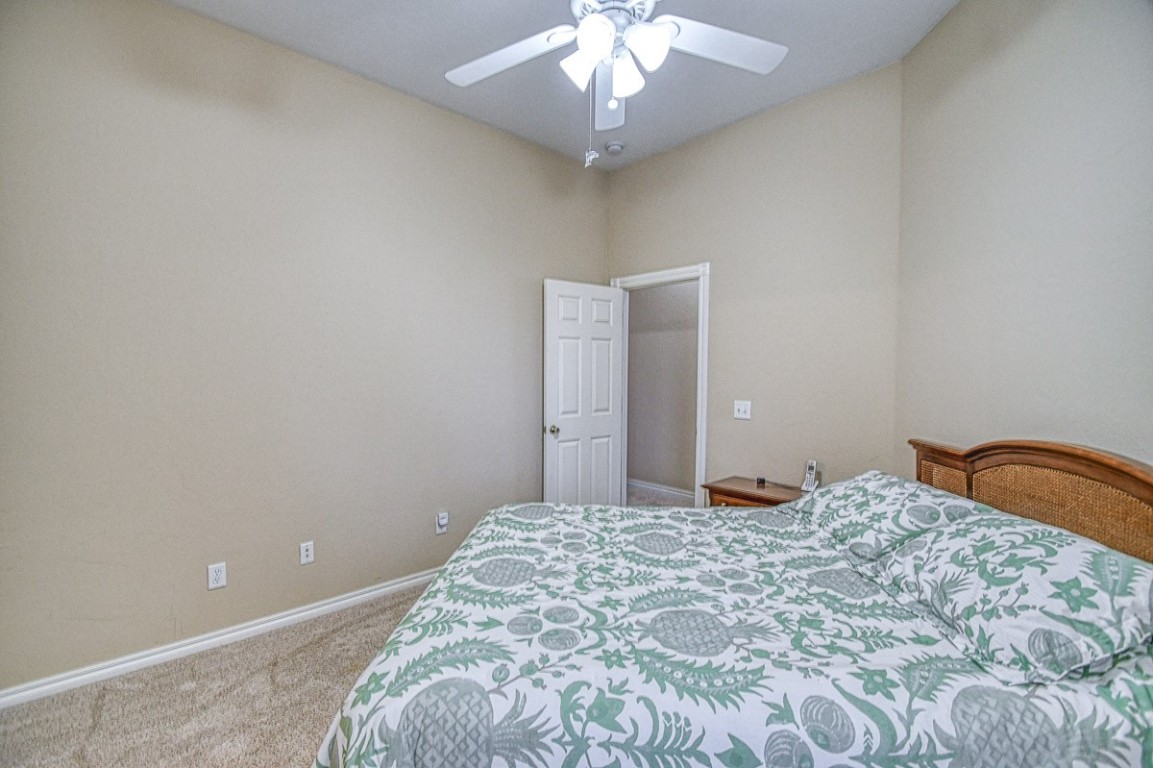 4508 Greystone Lane, Norman, OK 73072 carpeted bedroom with ceiling fan