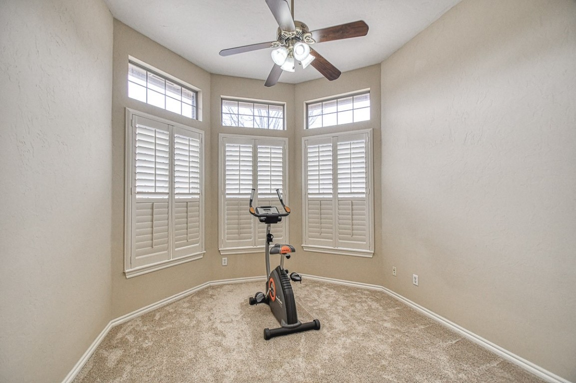 4508 Greystone Lane, Norman, OK 73072 workout room with carpet and ceiling fan