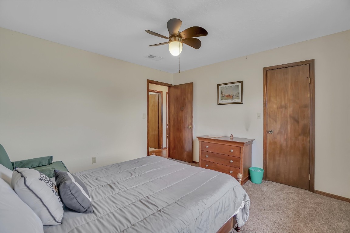 3028 Gettysburg Drive, Altus, OK 73521 bedroom with ceiling fan and carpet floors
