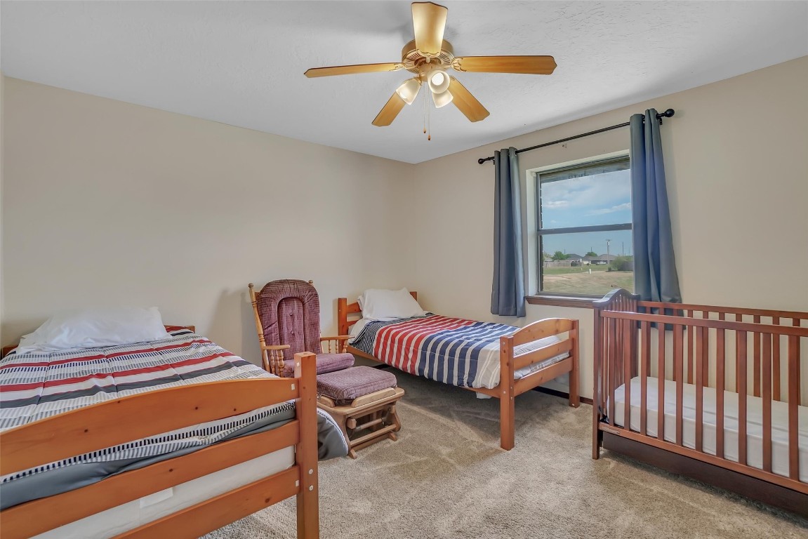 3028 Gettysburg Drive, Altus, OK 73521 carpeted bedroom with ceiling fan
