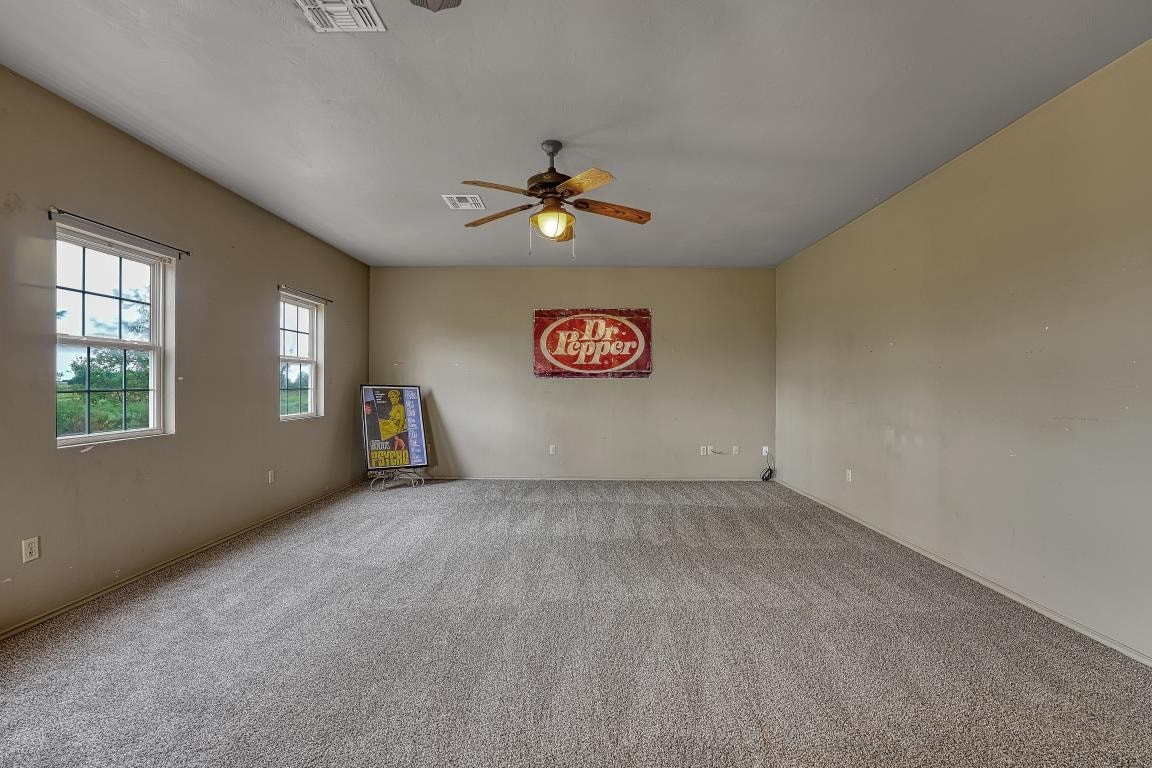 15448 S County Road 205 Road, Blair, OK 73526 carpeted spare room with ceiling fan