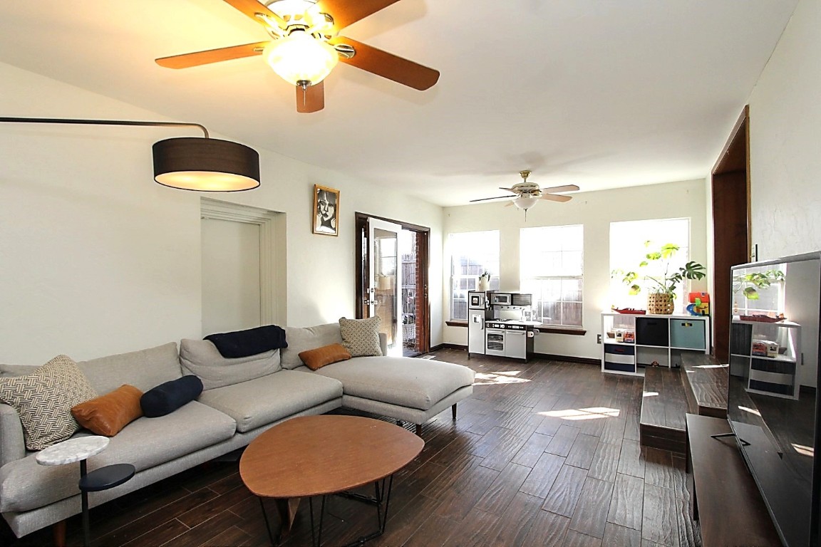 721 NW 48th Street, Oklahoma City, OK 73118 living room featuring dark hardwood / wood-style floors and ceiling fan