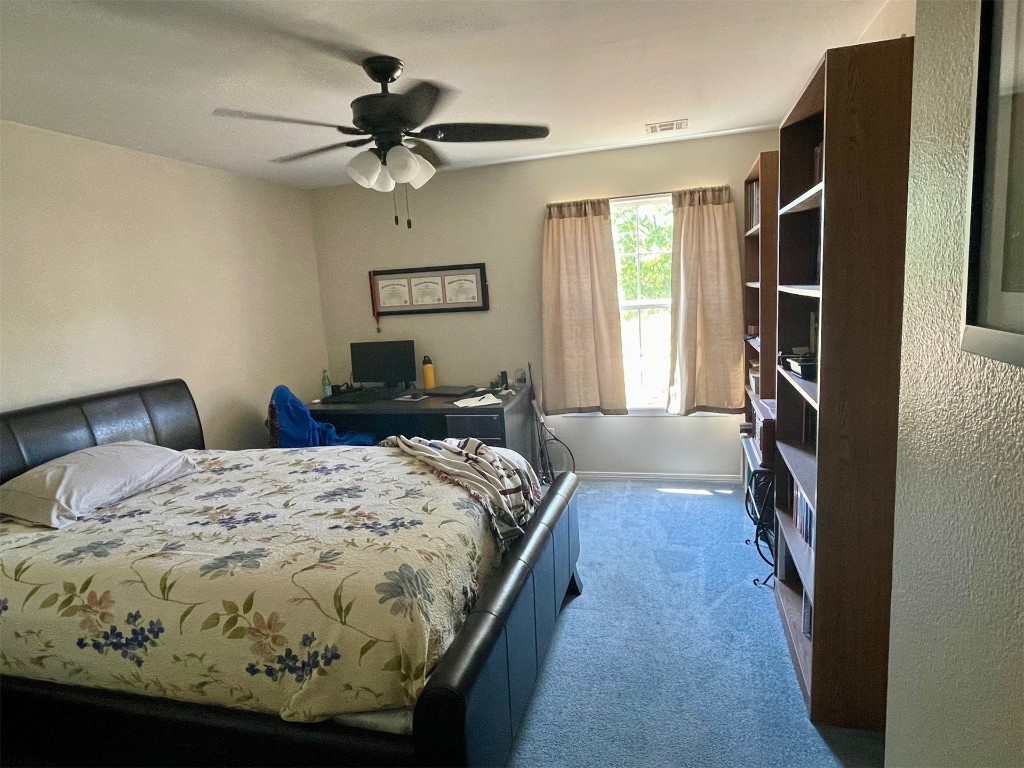 1523 N Grandview Street, Stillwater, OK 74075 bedroom with carpet flooring and ceiling fan