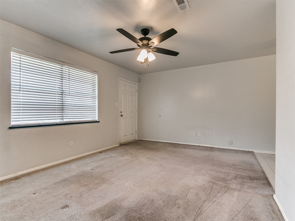 645 SW 3rd St, Moore, OK 73160 carpeted empty room featuring ceiling fan