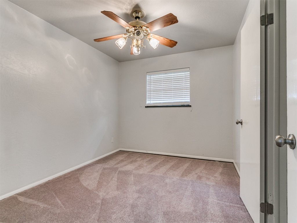 645 SW 3rd St, Moore, OK 73160 carpeted spare room featuring ceiling fan