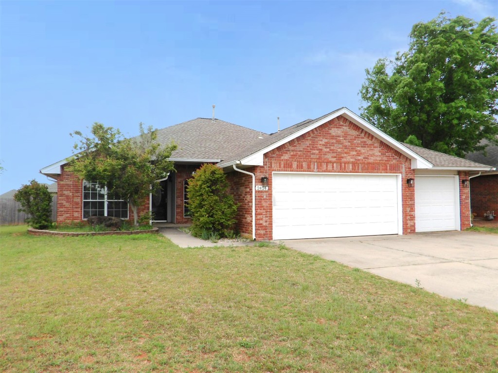 2424 Stonebridge Drive, Norman, OK 73071 single story home with a front yard and a garage