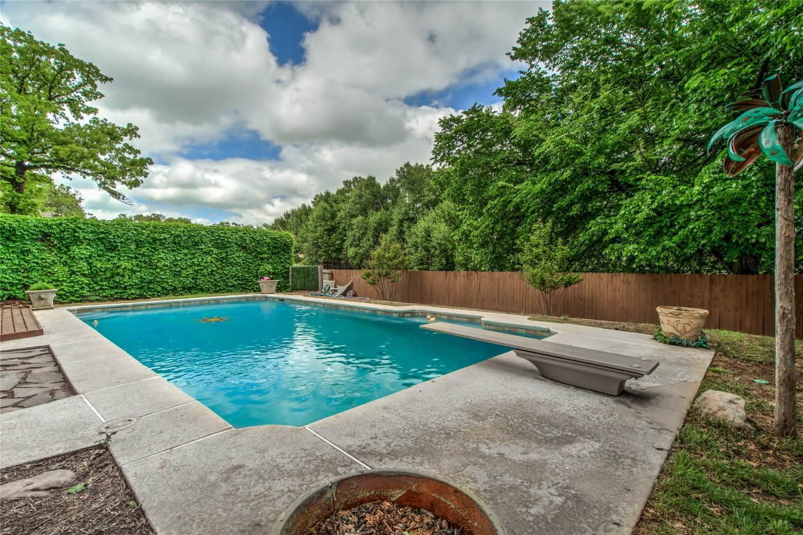 208 Crown Colony Court, Edmond, OK 73034 view of swimming pool with a patio and a diving board