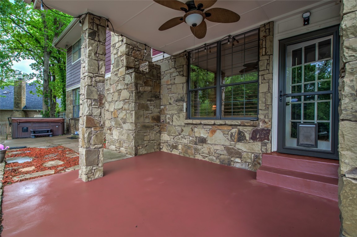 208 Crown Colony Court, Edmond, OK 73034 view of patio featuring ceiling fan and a hot tub