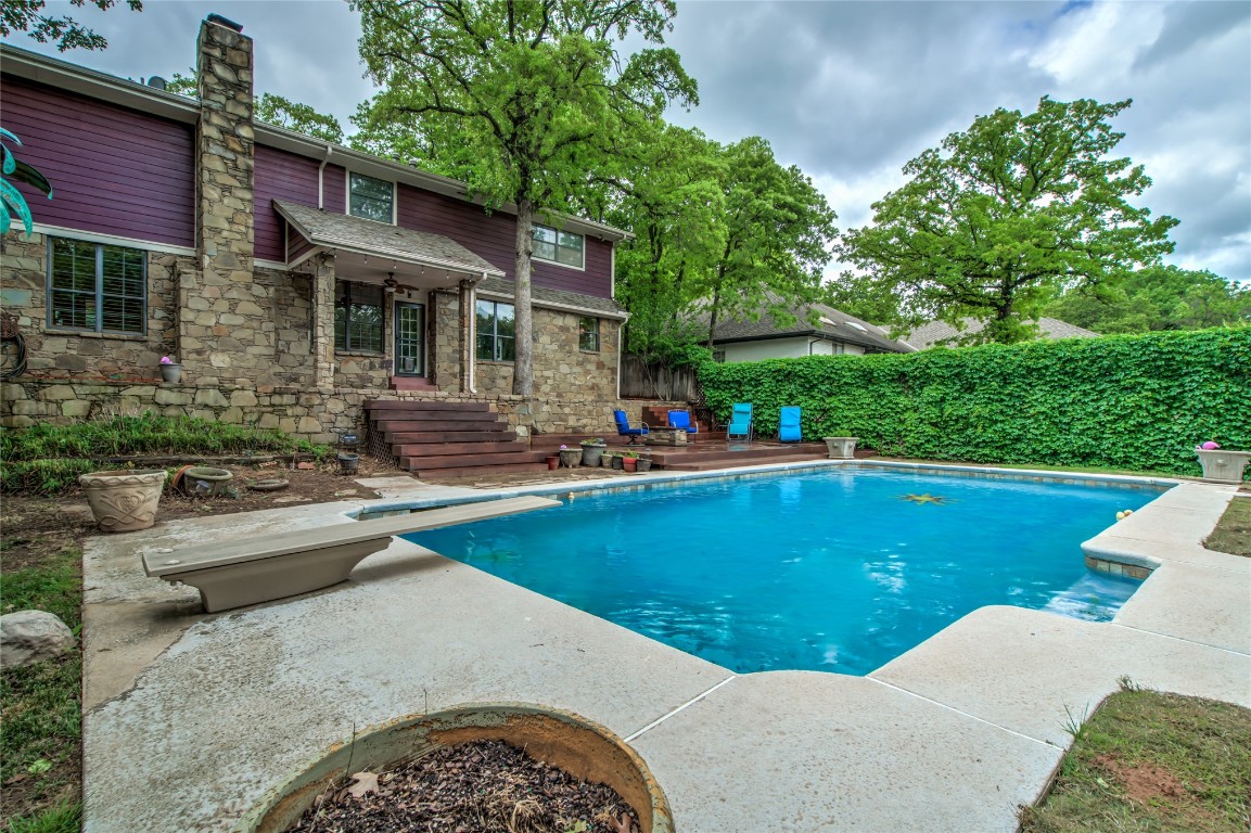 208 Crown Colony Court, Edmond, OK 73034 view of pool featuring a diving board