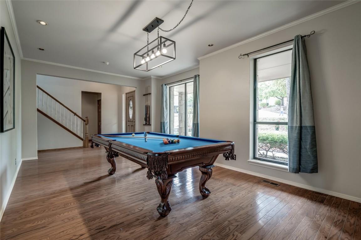 208 Crown Colony Court, Edmond, OK 73034 playroom featuring crown molding, wood-type flooring, and billiards