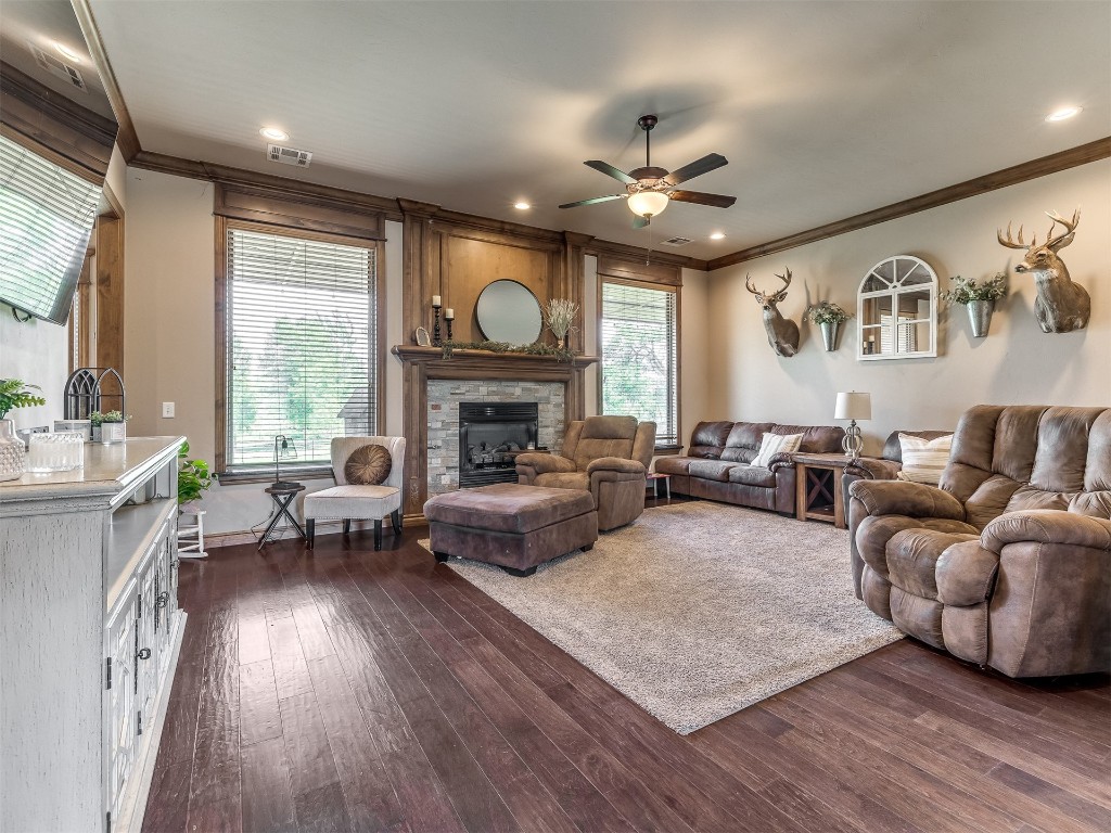 953 County Street 2982, Blanchard, OK 73010 living room with ornamental molding, dark hardwood / wood-style flooring, and ceiling fan