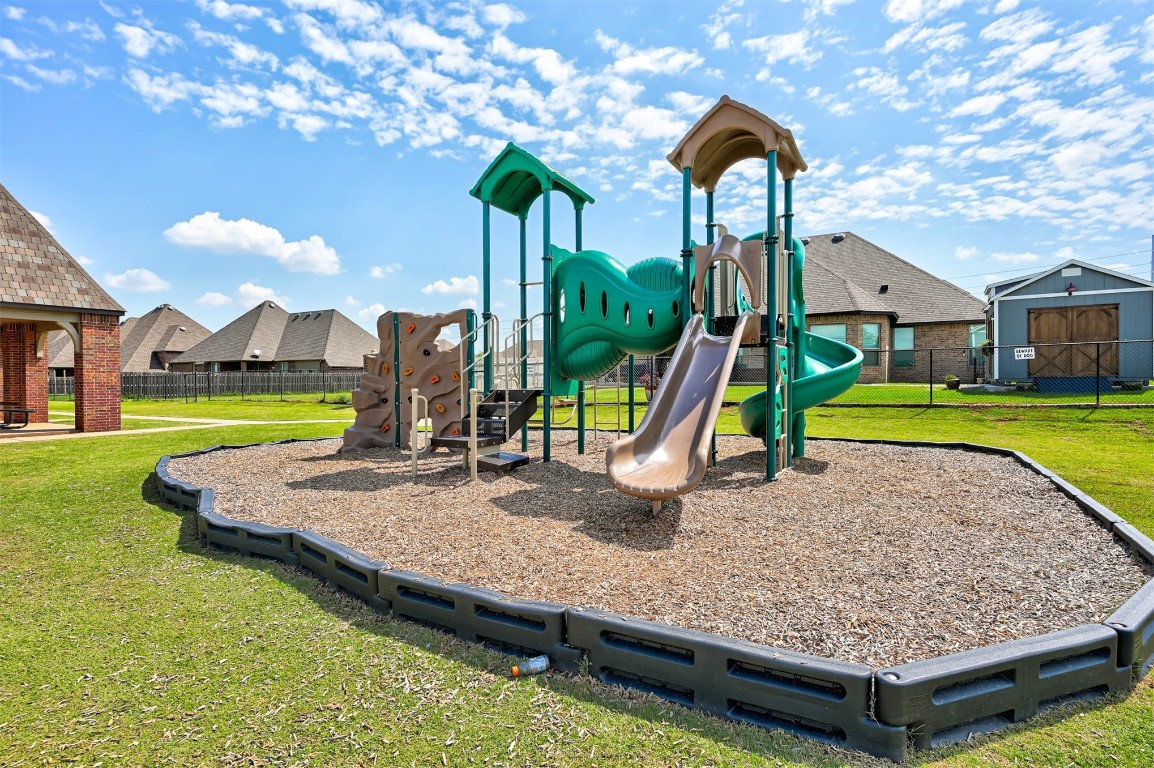 9204 SW 41st Street, Oklahoma City, OK 73179 view of playground with a yard