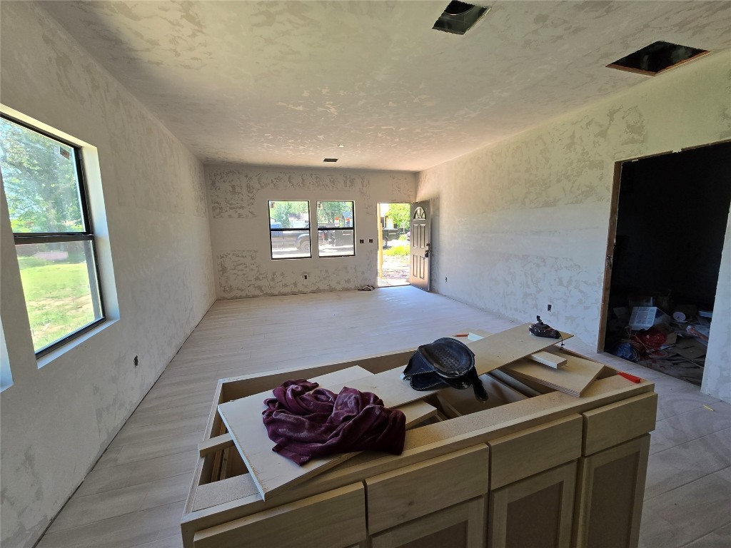 1435 NE 27th Street, Oklahoma City, OK 73111 unfurnished living room with light hardwood / wood-style flooring
