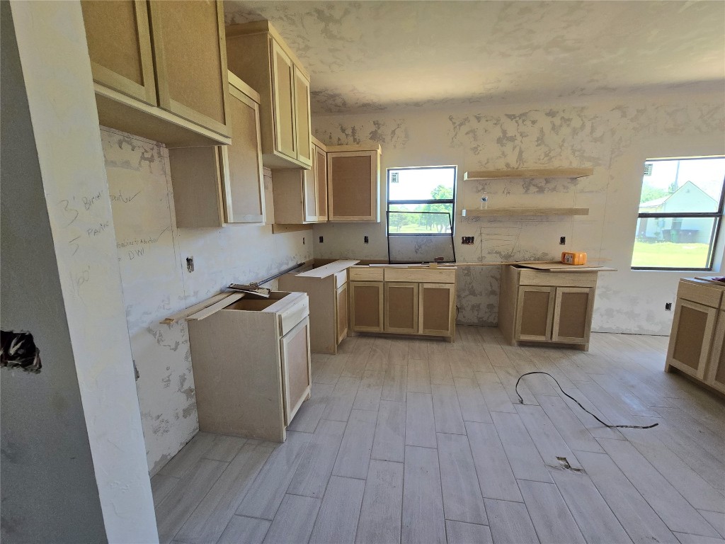 1435 NE 27th Street, Oklahoma City, OK 73111 kitchen with light hardwood / wood-style flooring