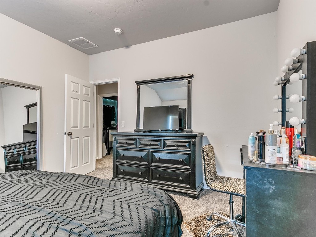 1016 S Appaloosa Lane, Mustang, OK 73064 view of carpeted bedroom